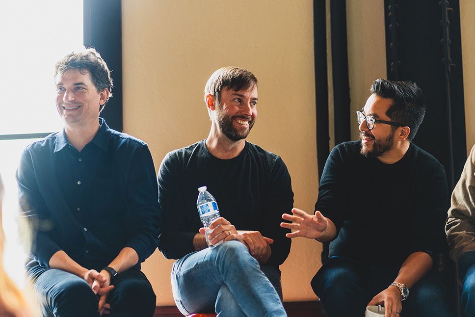 David Lieb speaks on a stage with Dalton Caldwell and Garry Tan